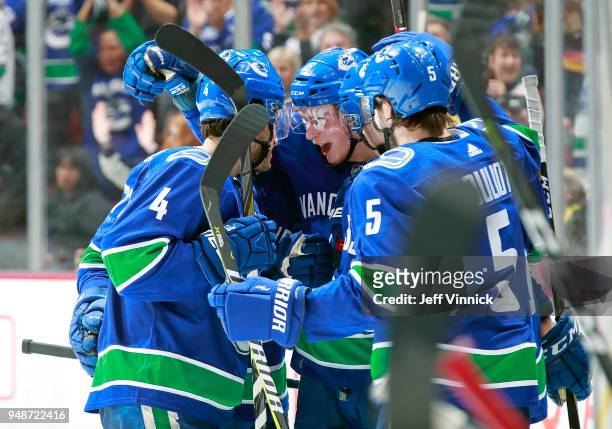 Jake Virtanen of the Vancouver Canucks is congratulated by teammates after scoring during their NHL game against the Arizona Coyotes at Rogers Arena...