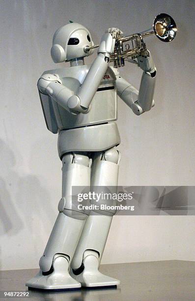Toyota Partner Robot" plays a trumpet during a press confernce by Toyota Motor Corp. In Tokyo, Japan Thursday, March 11, 2004.