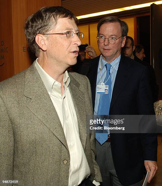William 'Bill' Gates, chairman of Microsoft Corp., left, speaks with Eric Schmidt, CEO of Google, as they leave a panel discussion they both...