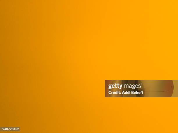 orange painted background - yellow wall stock pictures, royalty-free photos & images