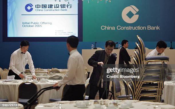 Hotel employees prepare a banquet hall Tuesday, October 4, 2005 for China Construction Bank in Hong Kong. Chairman Guo Shuqing met with bankers for...