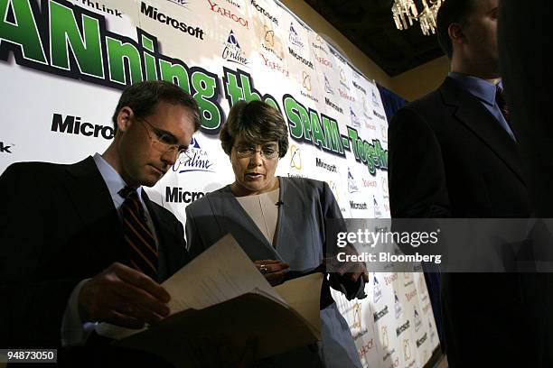 Nancy Anderson, right, Deputy General Counsel, Microsoft; confers with Mike Callahan, Senior VP and General Counsel, Yahoo; after a press conference...