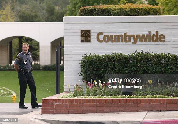 Security guard stands outside the Countrywide Financial Corp. Headquarters in Calabasas, California on Wednesday, October 20, 2004. Countrywide...
