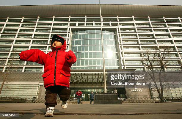 Boy walks in front of the headquarters of the Industrial & Commercial Bank of China in Beijing, China, Friday, January 27, 2006. Industrial &...