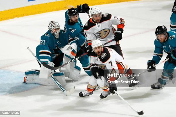 Andrew Cogliano and J.T. Brown of the Anaheim Ducks are defended by Martin Jones, Dylan DeMelo and Joe Pavelski of the San Jose Sharks in Game Three...