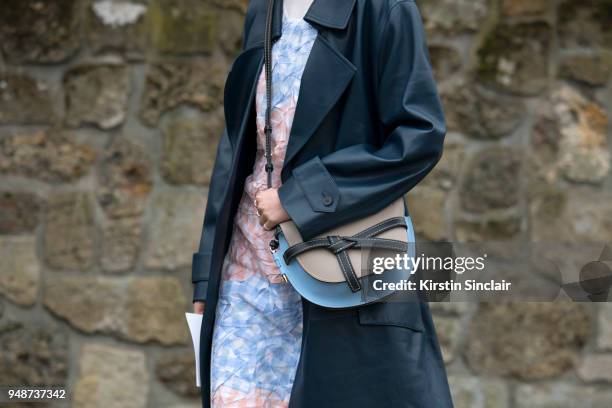 Fashion blogger and model Irene Kim wears a Celine jacket, Loewe bag and dress day 5 of Paris Womens Fashion Week Spring/Summer 2018, on March 2,...