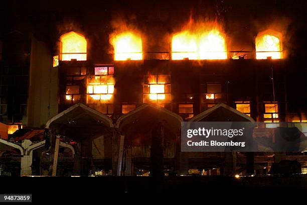 Fires burn at the Marriott Hotel after a suicide bomber drove an explosives-laden truck into the gate of hotel in Islamabad, Pakistan, on Saturday,...