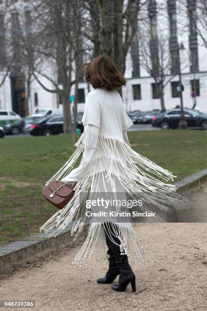 Fashion influencer Candela Novembre wears a Loewe dress, Louis Vuitton bag and Stuart Weitzman boots day 5 of Paris Womens Fashion Week Spring/Summer...