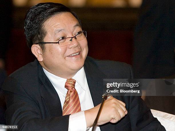 Kao Kim Hourn, Cambodia's secretary of state, smiles prior to the Association of Southeast Asian Nations foreign ministers' meeting with the...