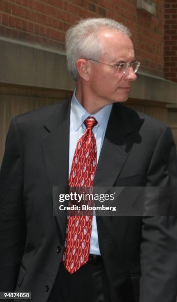 Richard Napier, looks away and talks to his attorney leaving Federal Court ,a former senior vice president at Berkshire Hathaway Inc.'s General Re...