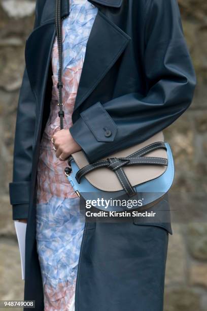 Fashion blogger and model Irene Kim wears a Celine jacket, Loewe bag and dress day 5 of Paris Womens Fashion Week Spring/Summer 2018, on March 2,...