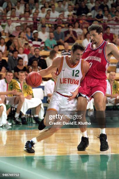 Summer Olympics: Croatia Toni Kukoc in action, defense vs Lithuania Arturas Karnisovas during Men's Preliminary Round - Group A game at Georgia Dome....