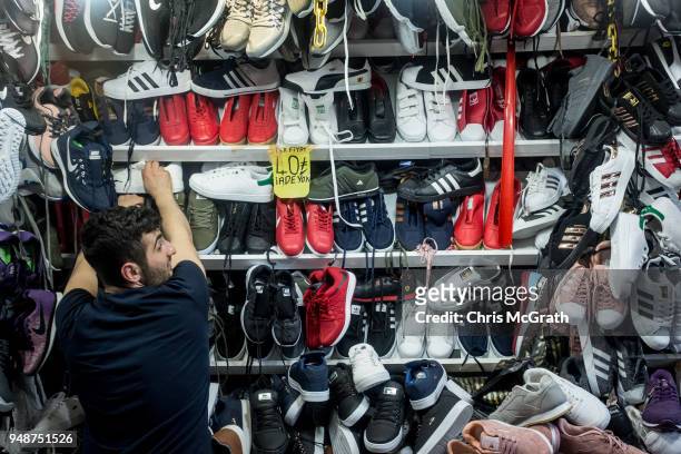 Man stacks a shelf at a showe store on April 19, 2018 in Istanbul, Turkey. Turkish President Recep Tayyip Erdogan on 18 April, 2018 announced a snap...