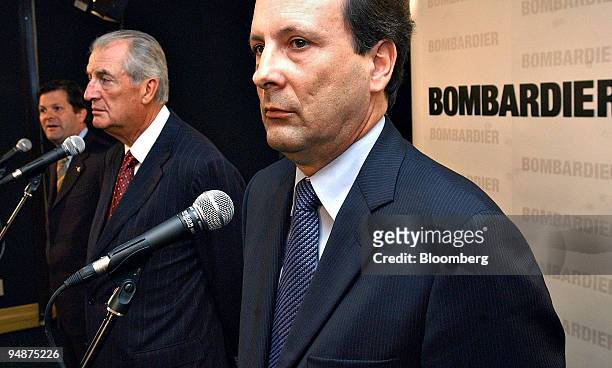 Andre Navarri, president of Bombardier Transportation, right, listens during a press conference with Pierre Beaudoin, president and COO of Bombardier...