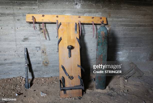 General view shows material used for torture by Jaish al-Islam fighters in an underground prison in the former rebel-held Syrian town of Douma on the...