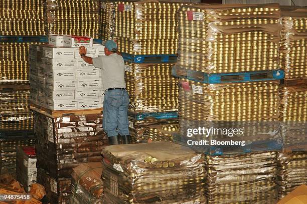 Ricky Melerine, manager of Bumble Bee Shrimp Canning plant, rescues inventory from the warehouse in Violet, Louisiana, September 30, 2005. The...