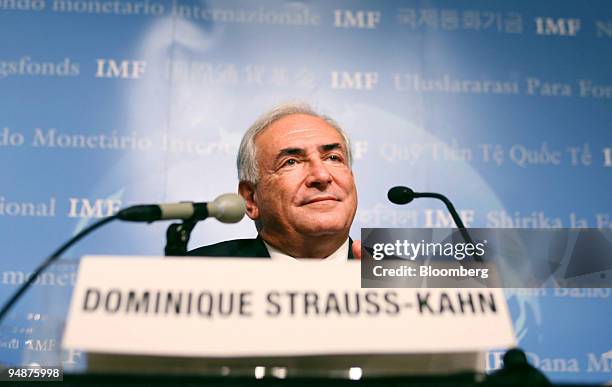 International Monetary Fund Managing Director Dominique Strauss-Kahn listens during a news briefing at the annual meetings of The World Bank and IMF...