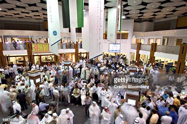 People work on the floor of the Dubai Financial Market, in the Dubai World Trade Centre in Dubai, United Arab Emirates Sunday, January 15, 2006.