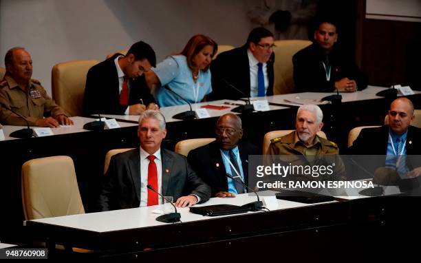 Cuba's new President Miguel Diaz-Canel sits next to the new members of Cuba's Council of State, First Vice-President Salvador Valdez Mesa ,...