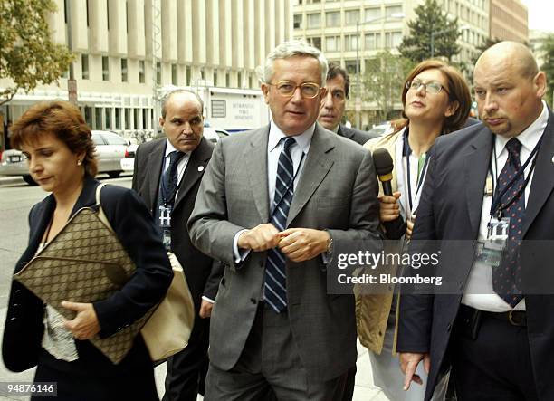 Italian Finance Minister Giulio Tremonti, center, walks with reporters and staff, September 2005 during a break, while attending the annual...