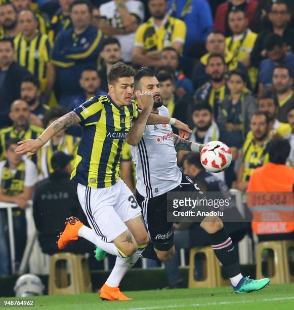 Roman Neustadter of Fenerbahce in action against Alvaro Negredo of Besiktas during Ziraat Turkish Cup Semi Final second leg soccer match between...