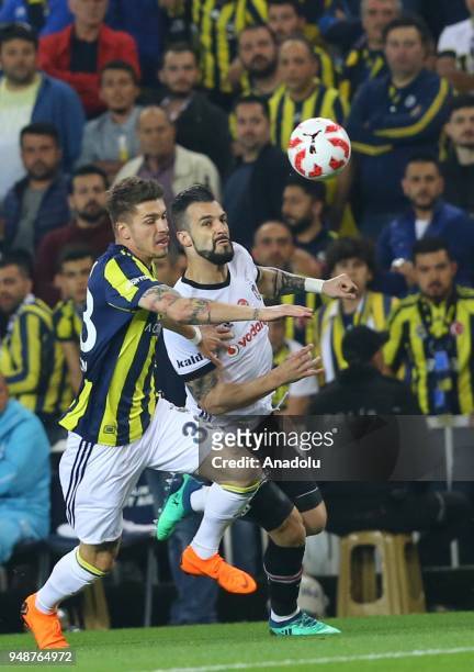 Roman Neustadter of Fenerbahce in action against Alvaro Negredo of Besiktas during Ziraat Turkish Cup Semi Final second leg soccer match between...