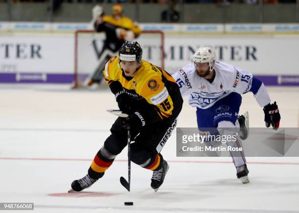 Stefan Loibl of Germany and Maurin Bouvet of France battle for the puck during the Icehockey International Friendly match between Germany and France...