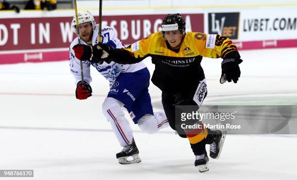 Marc Michaelis of Germany and Loc Lamperier of France battle for the puck during the Icehockey International Friendly match between Germany and...
