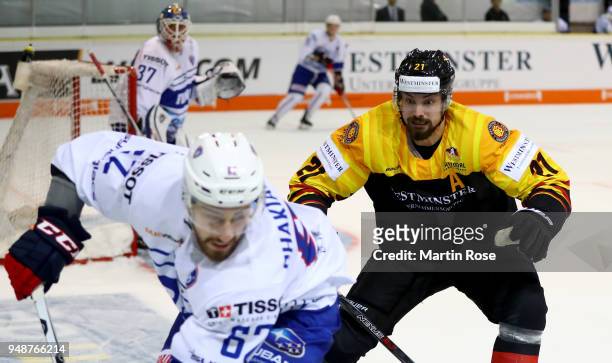 Nicolas Kraemmer of Germany and Florian Chakiachvili of France battle for the puck during the Icehockey International Friendly match between Germany...