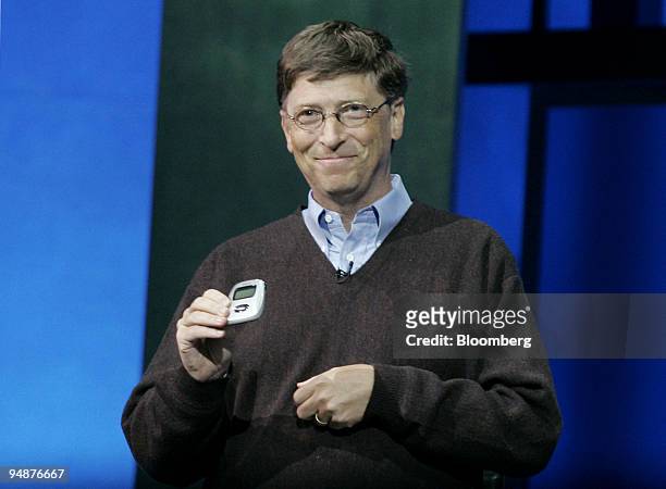 Bill Gates, Chairman and Chief Software Architect of Microsoft Corp., shows off a 'Rio Carbon', the worlds smallest 5GB digital music player, during...