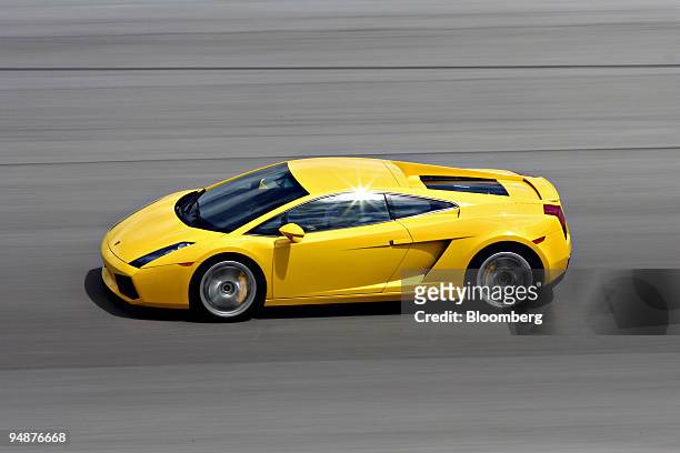 Lamborghini Gallardo is driven during the Supercar Life driving program at Homestead Miami Speedway in Homestead, Florida, U.S., on Monday, March 17,...
