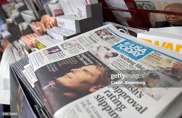 Copies of the Gannett Co. Newspaper USA Today sit on display at a newsstand in New York on October 12, 2004. Gannett Co., the largest U.S. Newspaper...