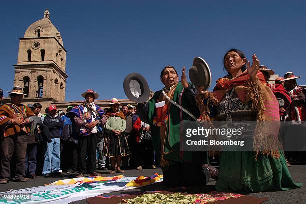 Aymara Indians pray in front of San Francisco Cathedral in downtown La Paz, Bolivia, during a protest to call for nationalization of oil and gas...