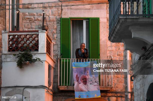Man attends the pastoral visit of Pope Francis in Molfetta,on 19 April, 2018