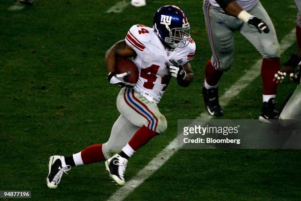 Ahmad Bradshaw of the New York Giants rushes the ball against the New England Patriots in the second quarter of Super Bowl 42 at the University of...