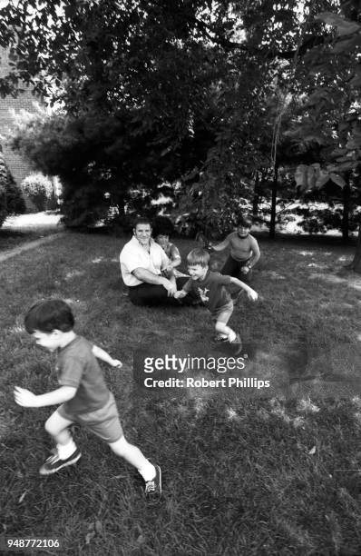 Casual portrait of Bruno Sammartino playing outside with wife Carol and sons Danny, Darryl and David Sammartino during photo shoot at home....