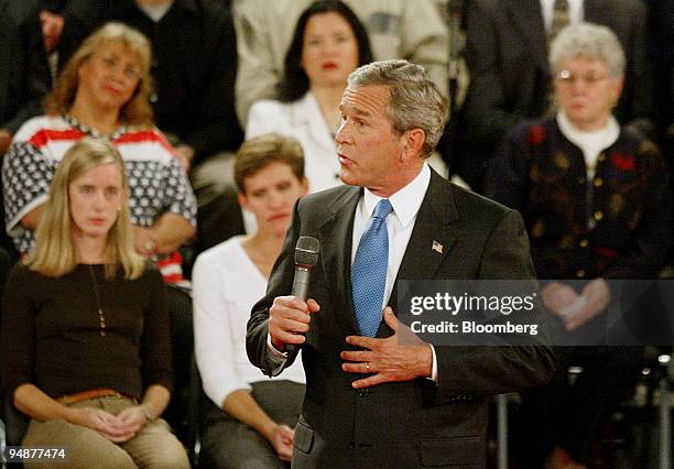 President George W. Bush answers a question from an undecided voter during the second Presidential Debate held in the Athletic Complex at Washington...