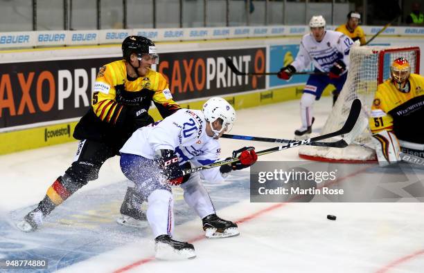 Benedikt Brueckner of Germany and Eliot Berthon of France battle for the puck during the Icehockey International Friendly match between Germany and...