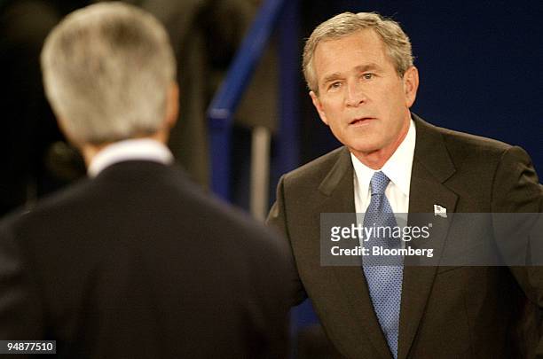 President George W. Bush, right, looks at Democratic presidential nominee Senator John Kerry during the second Presidential Debate held in the...