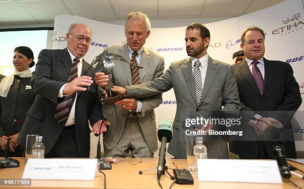 Scott Carson, chief executive officer of Boeing Commercial Airplanes, left, Jim McNerney, chief executive officer of Boeing Co., center left, Ahmed...