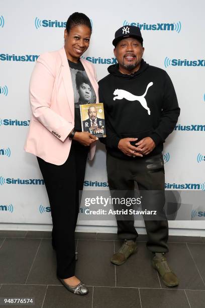 SiriusXM host Karen Hunter poses for photos with entrepreneur and author Daymond John during SiriusXMÕs Town Hall series at SiriusXM Studios on April...