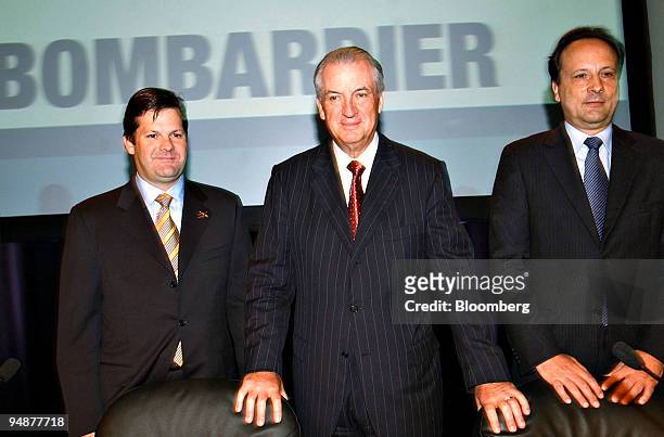 Pierre Beaudoin, president and COO of Bombardier Aerospace, left, poses with Laurent Beaudoin, chairman and CEO of Bombardier Inc., center, and Andre...