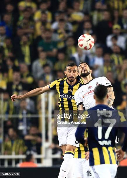 Mehmet Topal of Fenerbahce in action against Alvaro Negredo of Besiktas during Ziraat Turkish Cup Semi Final second leg soccer match between...