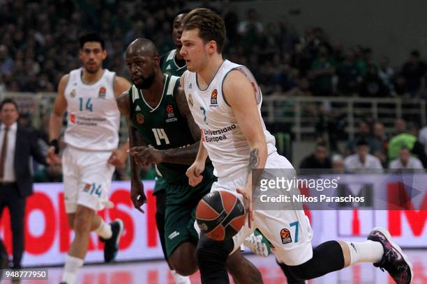 Luka Doncic, #7 of Real Madrid competes with James Gist, #14 of Panathinaikos Superfoods Athens during the Turkish Airlines Euroleague Play Offs Game...