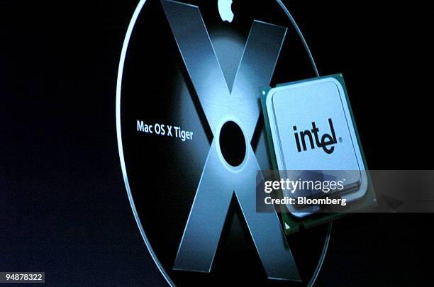 Graphic shows Apple's Mac OS X Tiger operating system alongside an Intel chip during Apple's Worldwide Developers Conference on Monday, June 6 in San...