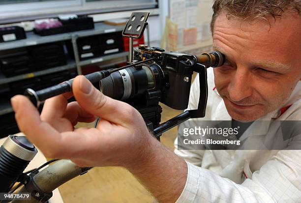 Technician adjusts the body of a camera under production at the Leica factory in Solms, Germany, Monday, June 6, 2005.