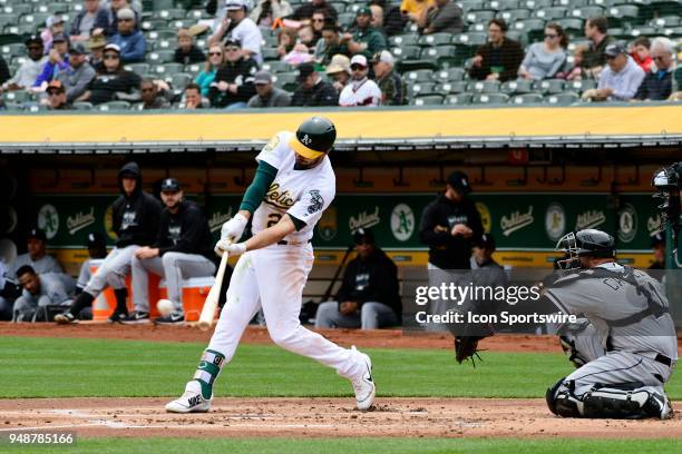 Oakland Athletics right fielder Matt Joyce connects for a two-base hit during the game between the Chicago White Sox verses the Oakland Athletics on...