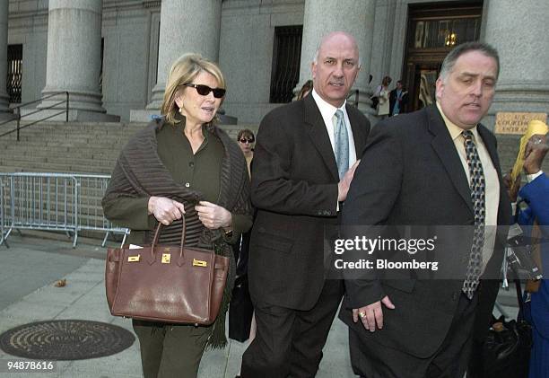 Martha Stewart, left, leaves Manhattan Federal Court with her bodyguard Frank Senerchia, center, in New York on March 3, 2004. After a five-week...