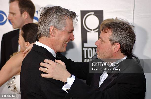 Playwrite John Patrick Shanley and Director Doug Hughs of the play "Doubt" embrace as they arrive at the 56th annual Tony Awards at Radio City Music...