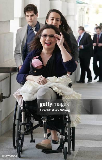 Sen. Tammy Duckworth arrives at the U.S. Capitol with her newborn baby daughter Maile Pearl Bowlsbey for a vote on the Senate floor April 19, 2018 on...